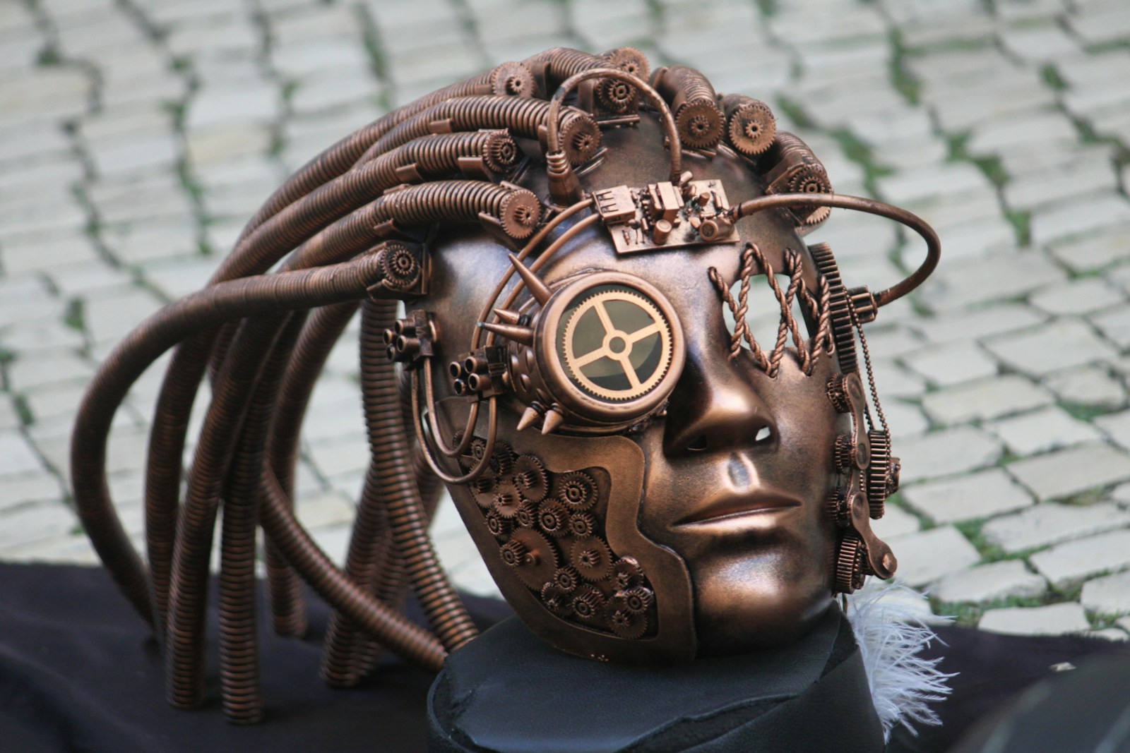 a sculpture of a human head with wires attached to it